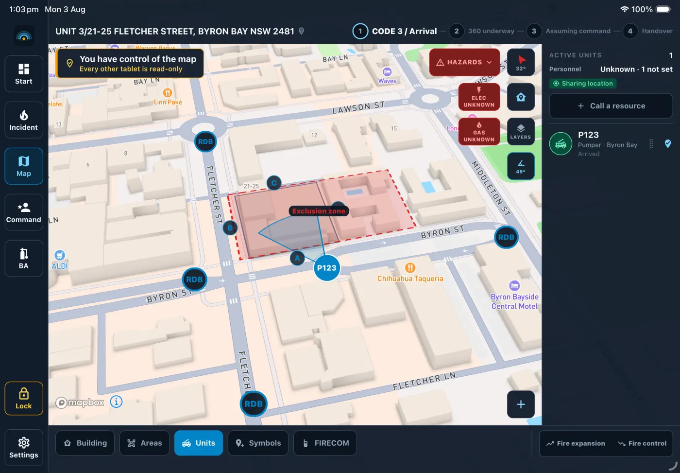 The On-Scene tactical map on a tablet: one pumper on scene, an exclusion zone drawn around the fire building, four roadblocks on the surrounding streets, and the building’s A, B and C sides lettered, over a street map of the block seen from above.